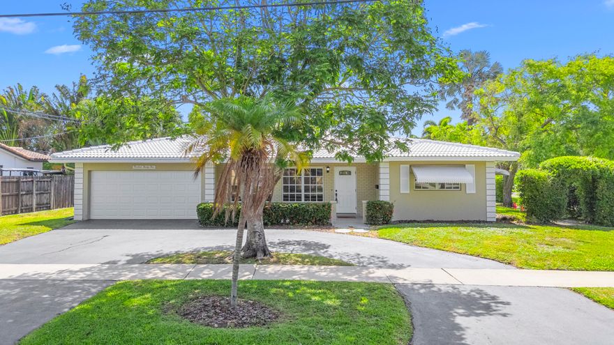 Spacious single-family home located in the highly desirable Cove neighborhood of Deerfield Beach. Situated on an oversized corner lot with plenty of room for your boat and all your toys — no HOA! Property is currently being fenced in with brand-new vinyl fencing for added privacy and enjoyment. Features include a two-car garage, circular driveway plus plenty of backyard space to add a pool — perfect for living the South Florida lifestyle.  This charming home has a bright, open layout featuring a split floor plan with hardwood flooring throughout the main living areas of the home. Kitchen boasts wood cabinetry, recessed lighting, granite countertops, and stainless-steel appliances. Versatile extra room adds extra living space perfect for a game room or entertaining area.  Currently the back yard features a permitted concrete patio pad that could be converted into multiple uses, you decide.  A fantastic opportunity to own with endless potential!. Conveniently located near the award-winning Deerfield Beach, top-rated schools, shopping, waterfront dining, I95 and all the attractions of coastal living. A rare opportunity in a prime location — present all offers!