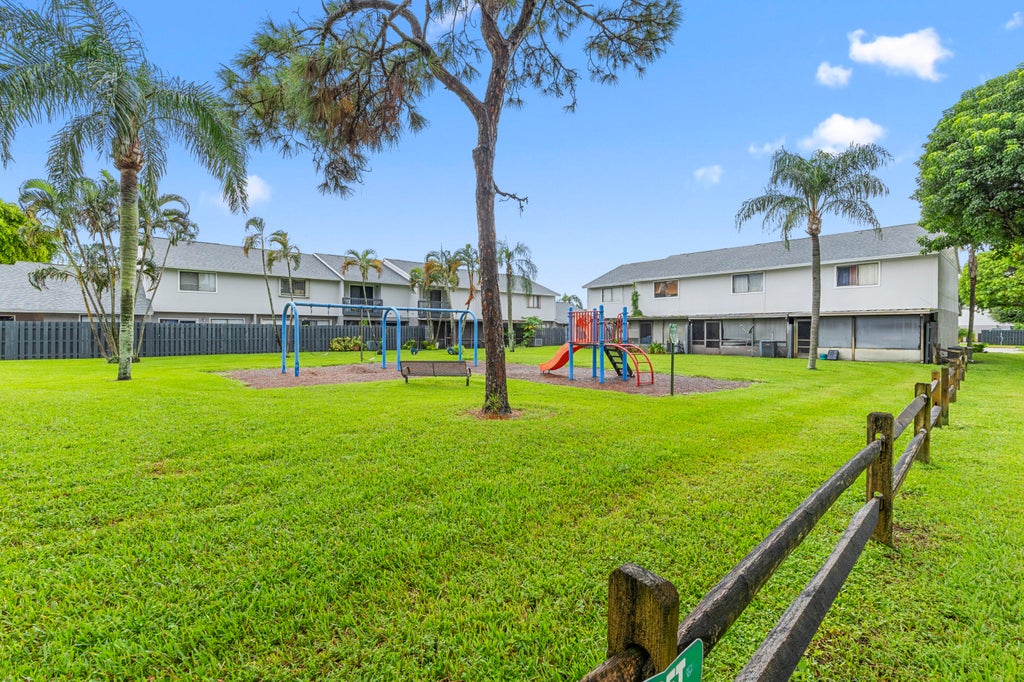 Photo of 5703 Channel Drive, Greenacres, FL 33463 (MLS # B26077232)