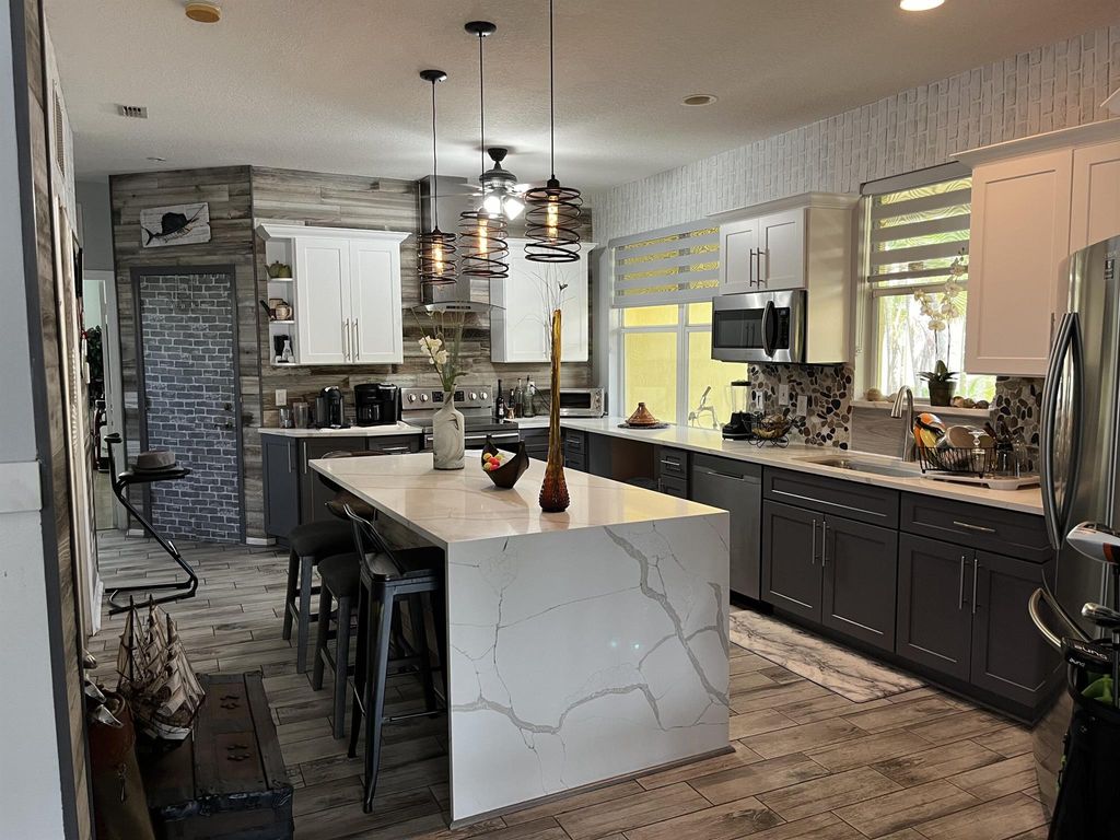 Photo of 9830 SW Eastbrook Circle, Port Saint Lucie, FL 34987 (MLS # R11003098)