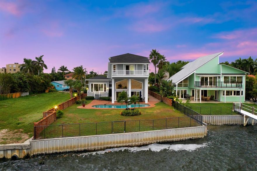 WATERFRONT LIVING AT IT'S FINEST! Located directly on the Intracoastal in beautiful Lake Worth Beach, close to Manalapan and Palm Beach Island with 60ft of water frontage and minutes away from the ocean via the Boynton Inlet. This newly renovated residence is totally unique, constructed from 17 steel columns anchored into the ground and connected on top with a 10-inch steel plate, encased with bricks imported from a church in New York. This casually elegant home welcomes you into the bright and airy living area with brand new porcelain tile floors and sliding doors that lead out to a spacious deck and the pool beyond.