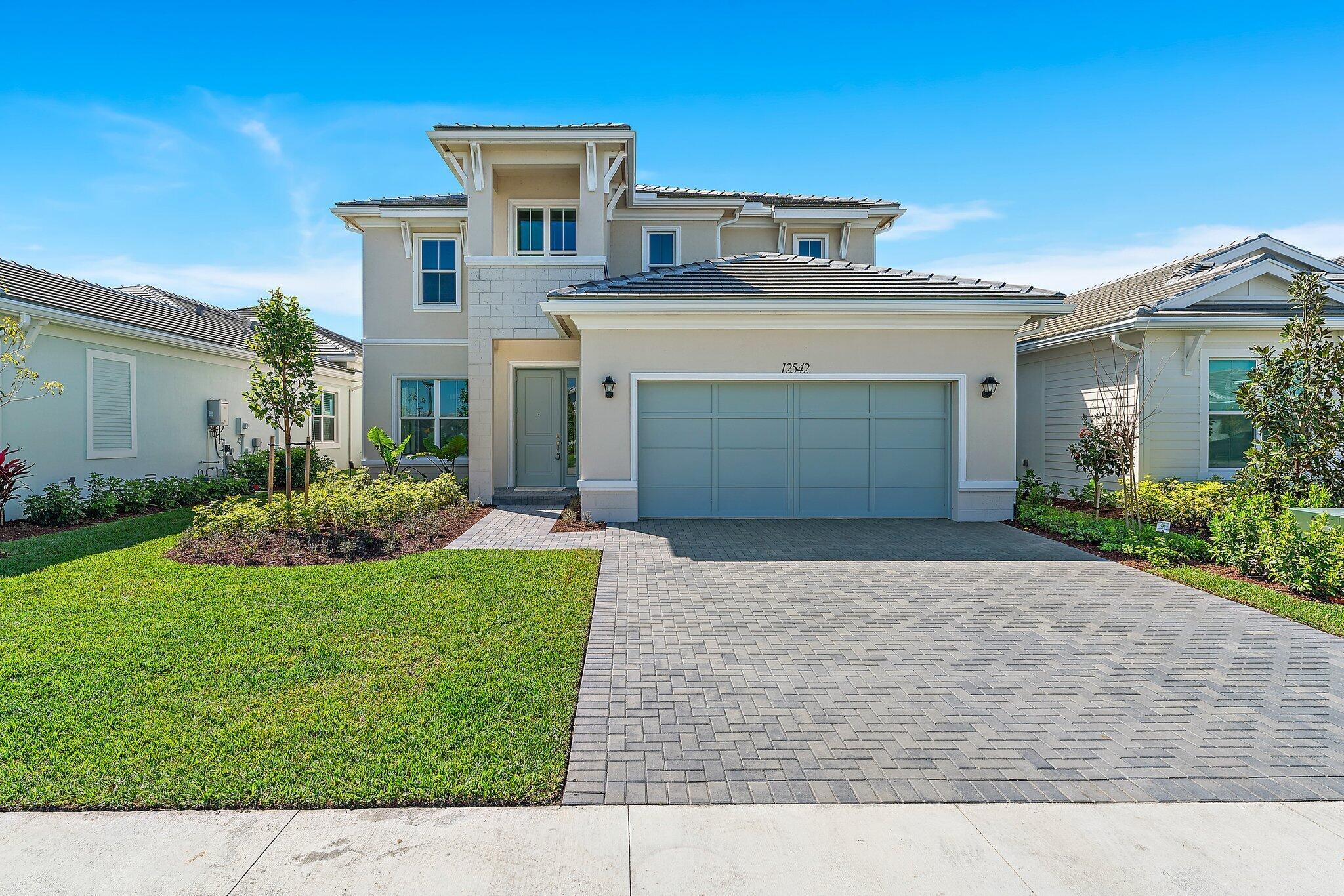 WATERVIEW! Absolutely Stunning Torrence Model At the Wonderful Gated Community Of Windgate At Avenir. Offering 5 Bedrooms, 3 Bathrooms, A Dedicated Office & 3 Car Garage. Step Inside This Magnificently Upgraded Home With Neutral Wood Look Tile Floors And Open Concept Kitchen That Overlooks the Family Room. The Kitchen Boasts Wood Shaker Style Cabinetry With Modern Hardware, White Quartz Countertops, SS Appliances, GAS Cooktop, and Spacious Pantry. ALL Impact Windows & Doors, Beautiful Wood Staircase & Upgraded Modern Style Lighting. Your Guests Will Enjoy Complete Privacy With the Guest Room And Full Bathroom On the First Floor.