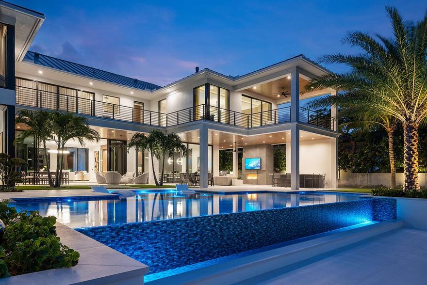 Situated in Boca Raton's most prestigious community, this brand new waterfront SRD Signature Estate offers the height of luxury and elegance combined with the latest high-tech upgrades. Indoor and outdoor living spaces are perfectly intertwined, and panoramic waterway views are celebrated. Walls of full-height windows glide along tracks until they virtually disappear extending the 8,700 living sf into the private outdoor terraces, resort-grade pool, and private dock. Large-format white porcelain floors traverse the home filled with custom-designed millwork, cabinetry, lighting elements, and designer hardware. Upstairs, 6 bedroom suites of grand proportion are found, and most access the incredible covered and open balcony that spans the length of the entire home enjoying perfect pool and waterway views. Smart home technology with Crestron interfacing control lighting, climate, window shades, music, security, and more! Buyer to pay documentary stamp taxes on the deed and title insurance.