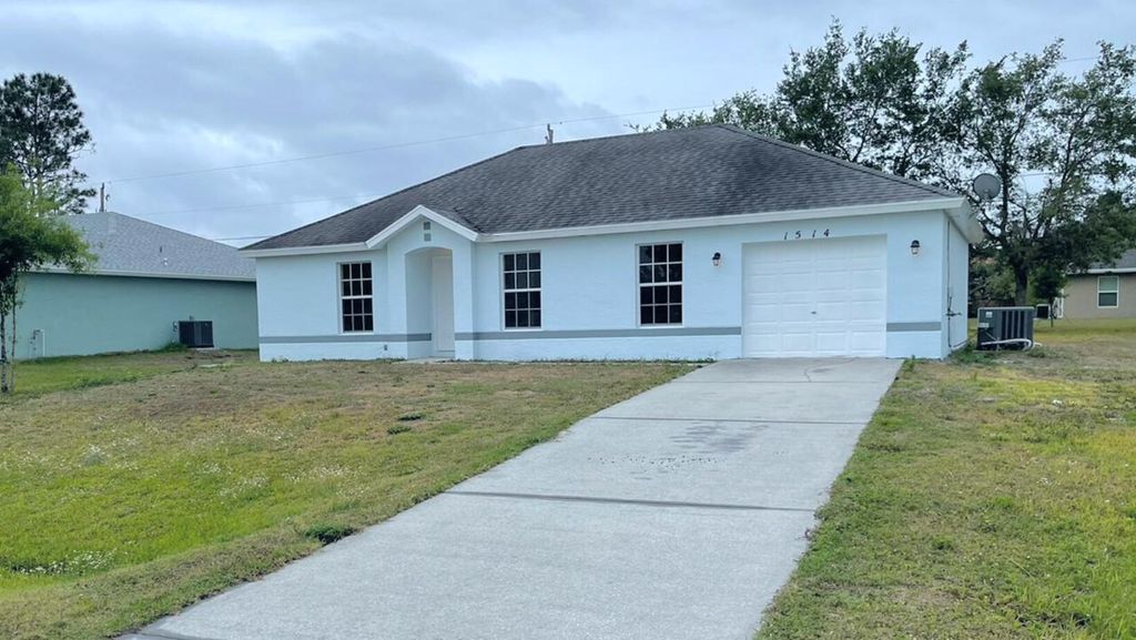 Photo of 1514 SW California Boulevard, Port St Lucie, FL 34953 (MLS # R10907008)