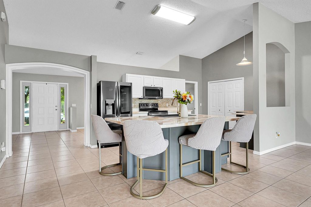 Photo of 933 SE Caravan Avenue, Port Saint Lucie, FL 34983 (MLS # R11107962)