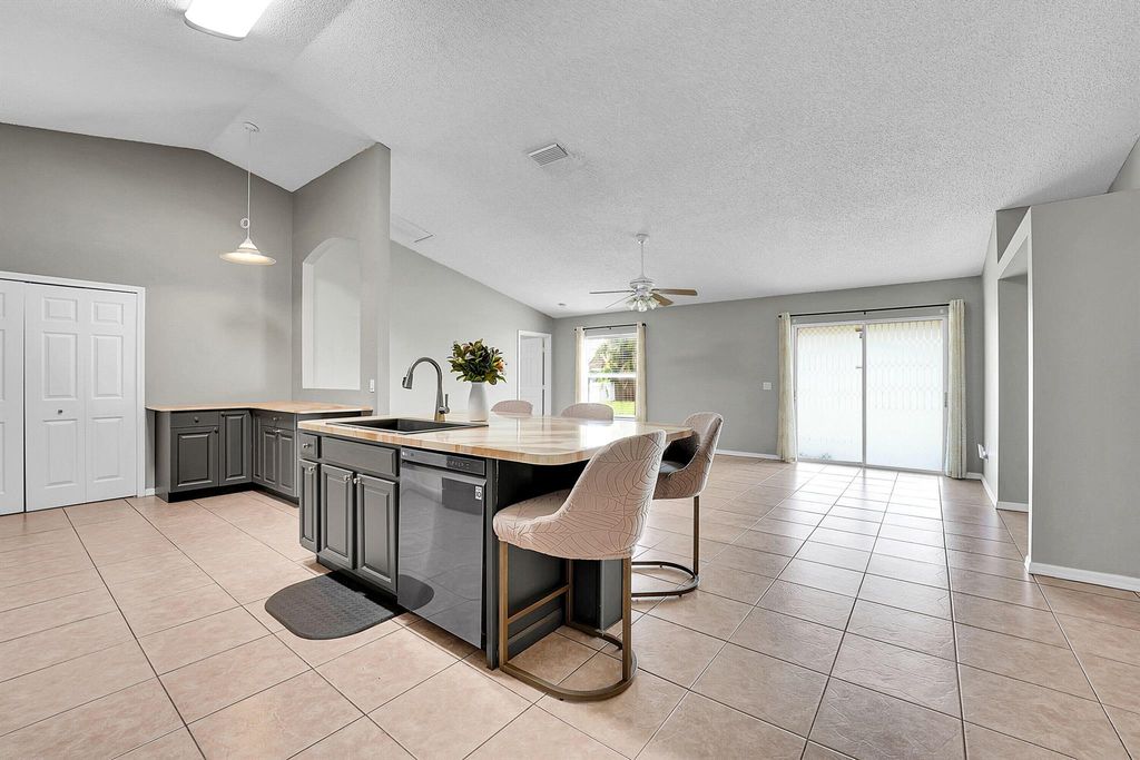 Photo of 933 SE Caravan Avenue, Port Saint Lucie, FL 34983 (MLS # R11107962)