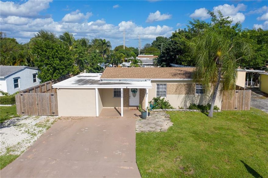 Pompano Beach! Updated 3 Bedroom 2 Bath with Large Workshop/Storage shed in fenced backyard. Tile Floors and laminated wood floors throughout the home. Beautiful Wood Cabinets in Kitchen with Granite countertops. Stainless Steel Appliances and a Front Loading Washer and Dryer in the Master Suite. New Roof in 2018, Updated Electric and Hurricane panels for all windows. A double gated sideyard gives access to backyard with plenty of storage for Boat, Trailers and/or other toys. Concrete Driveway, Newer Central Air Conditioning and a Tankless water heater.  A great East location with easy access to Federal Highway, Copans Road and I95.