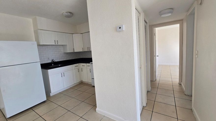 Just Listed! Spacious and well maintained 2 bedroom 1 bath apartment located on the second floor of a gated community. This move in ready apartment features a bright kitchen with white tile backsplash and ample cabinet space. Community amenities include on site laundry facilities. Conveniently located near beaches, shopping, dining, and public transportation.Housing vouchers welcome.Contact listing agent for additional information and showing instructions.