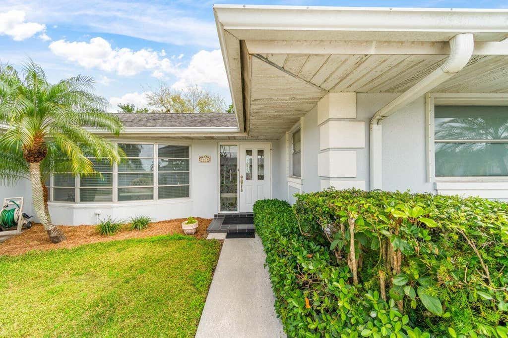 Photo of 9676 Honeysuckle Avenue, Palm Beach Gardens, FL 33410 (MLS # R10966219)