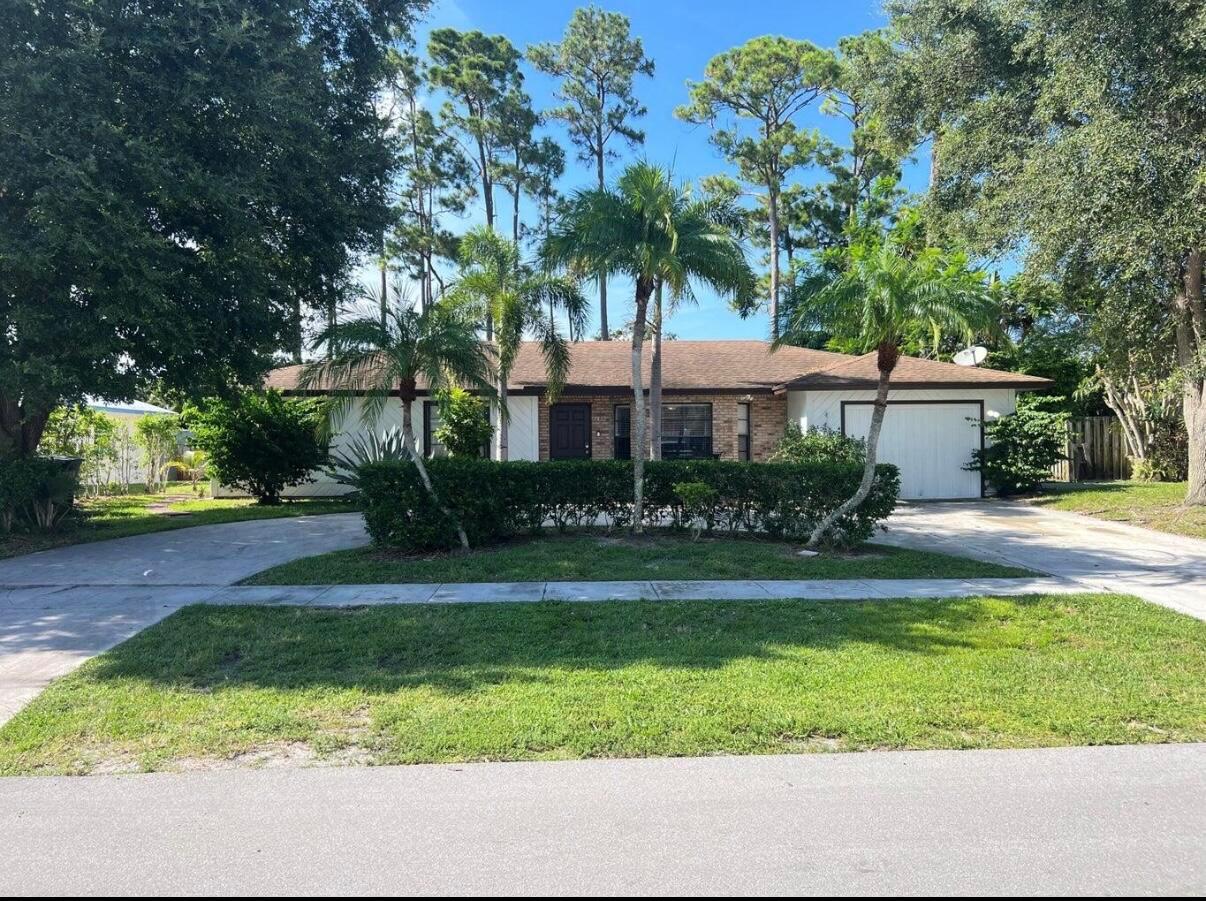 Rent is $3500/ Monthly that includes all utilities: electricity, water, high speed internet, lawn care, and trash. Small pets (up to 15lbs) are welcome! Unfurnished and beautifully renovated single-family home. This stunning property offers a serene canal view. The home features a spacious driveway for up to three cars, and commercial vehicles are allowed. NO HOA RESTRICTIONS! Two efficiencies with independent entrances are already rented on both sides of the house.