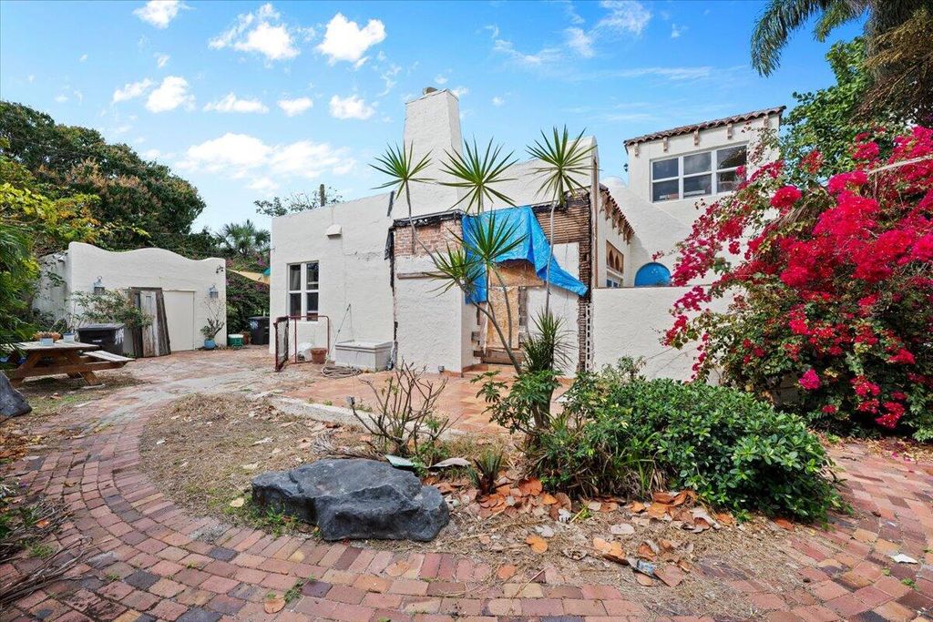 Photo of 418 E Lakewood Road, West Palm Beach, FL 33405 (MLS # B26003642)