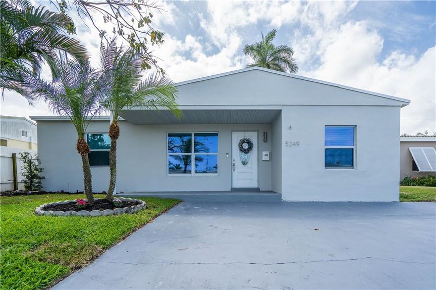 This is the one you have been waiting for! Completely remodeled 3 bedroom / 2 full bath property with a modern, yet timeless design this home checks all the boxes! Perfect for a vacation home or to live in. Hurricane Impact windows and doors throughout, and newer roof installed in 2019. The kitchen is situated perfectly with an open concept design to the living room and dining area. High-end cabinetry and appliances create a functional yet elegant kitchen experience. Large, fenced backyard with grass and natural landscape giving you plenty of room to enjoy beautiful South Florida. Close to the beach, restaurants, shopping and hotels.
