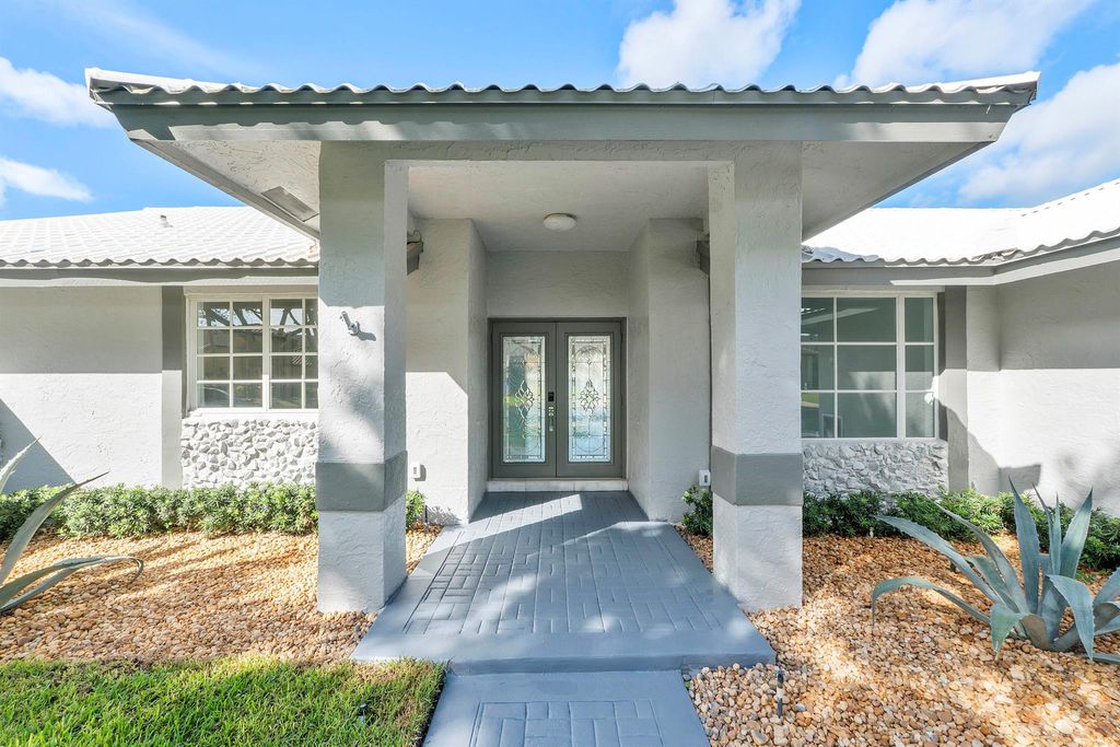 Photo of 6000 NW 63 Place, Parkland, FL 33067 (MLS # R11113299)