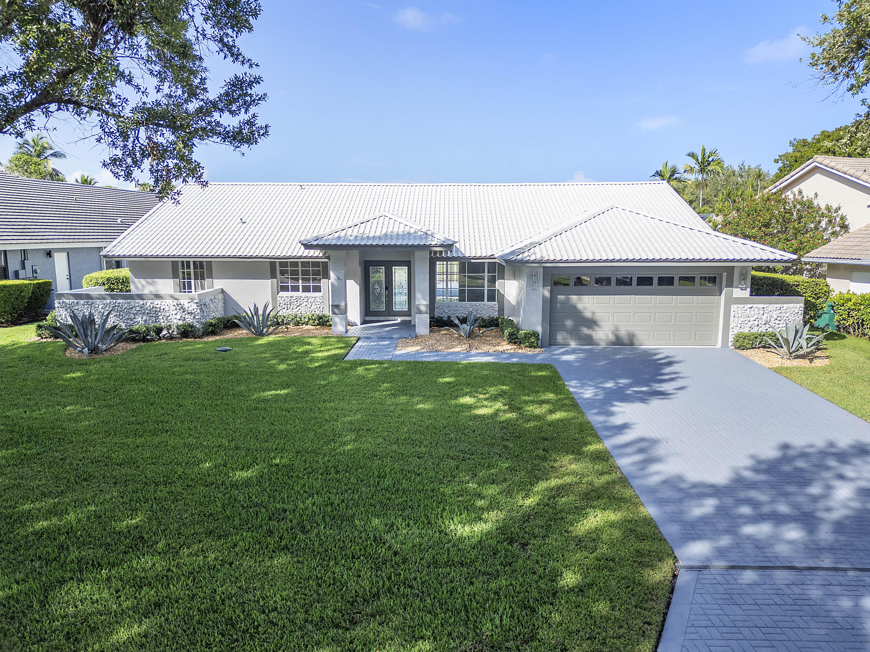 Amazing opportunity to own the least expensive 5 bedroom, 3 bath pool home in Parkland, located in the gated community of Country Point Estates with A rated schools. Bring your suitcase and toothbrush as all the updating has been completed for you. 5 bedrooms, 3 full baths remodeled with steam shower, hurricane ready with metal roof, impact windows, and full home standby generator.Marble floors in the main living area with 9.5mm waterproof vinyl planks in all the bedrooms, home has vaulted ceilings and entire house has LED recessed lighting.Enjoy your fenced in patio and pool while overlooking the waterway with grass backyard on a cul de sac street, and do not overlook the freshly epoxied garage floors. Every stone has been turned in this lovely home in a family oriented community