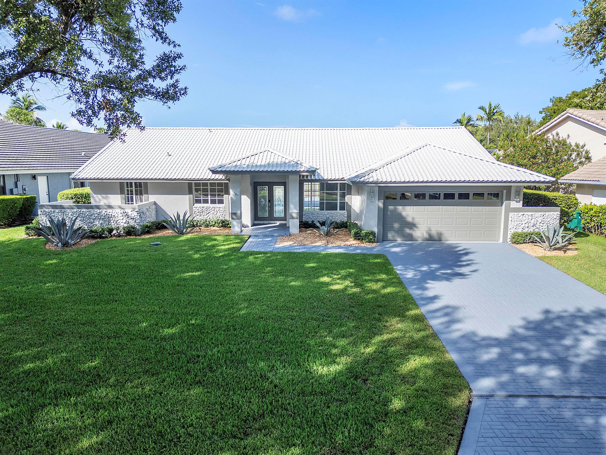 Amazing opportunity to own the least expensive 5 bedroom, 3 bath pool home in Parkland, located in the gated community of Country Point Estates with A rated schools. Bring your suitcase and toothbrush as all the updating has been completed for you. 5 bedrooms, 3 full baths remodeled with steam shower, hurricane ready with metal roof, impact windows, and full home standby generator.Marble floors in the main living area with 9.5mm waterproof vinyl planks in all the bedrooms, home has vaulted ceilings and entire house has LED recessed lighting.Enjoy your fenced in patio and pool while overlooking the waterway with grass backyard on a cul de sac street, and do not overlook the freshly epoxied garage floors. Every stone has been turned in this lovely home in a family oriented community
