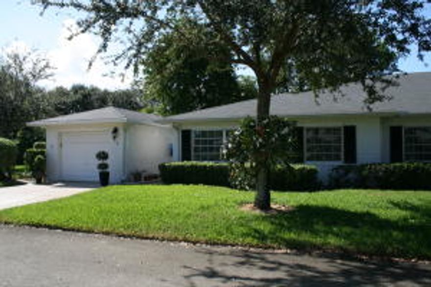 THIS IS A RARELY AVAILABLE CORNER UNIT AT THE END OF A QUIET STREET. A VERY SOUGHT AFTER ONE CAR GARAGE CONDO IN PRISTINE CONDITION. THERE ISN'T ANYTHING YOU HAVE TO DO TO THIS HOME. IT HAS ALL THE UPGRADES FROM A GORGEOUS COMPLETELY UPDATED KITCHEN THAT BOASTS NEW STAINLESS STEEL APPLIANCES AND GRANITE COUNTERTOPS AS WELL AS BRAND NEW 42'' WOOD CABINETS WITH UNDER CABINET LIGHTING. TILED FLOORS IN MAIN LIVING AREAS AND WOOD FLOORS IN BEDROOMS. BOTH BATHROOMS ARE GENEROUSLY  UPDATED AND BEAUTIFULLY DONE WITH ALL NEW TOILETS, FIXTURES AND VANITIES. THE MASTER BEDROOM HAS A HUGE WALK IN CLOSET ALONG WITH A SECOND CLOSET TOO. THERE IS ALSO ACCESS TO THE ATTIC MAKING FOR EVEN MORE STORAGE. BECAUSE OF THE LOCATION AT THE END OF THE STREET YOU GET A CONSTANT BREEZE COMING FROM THE EAST.