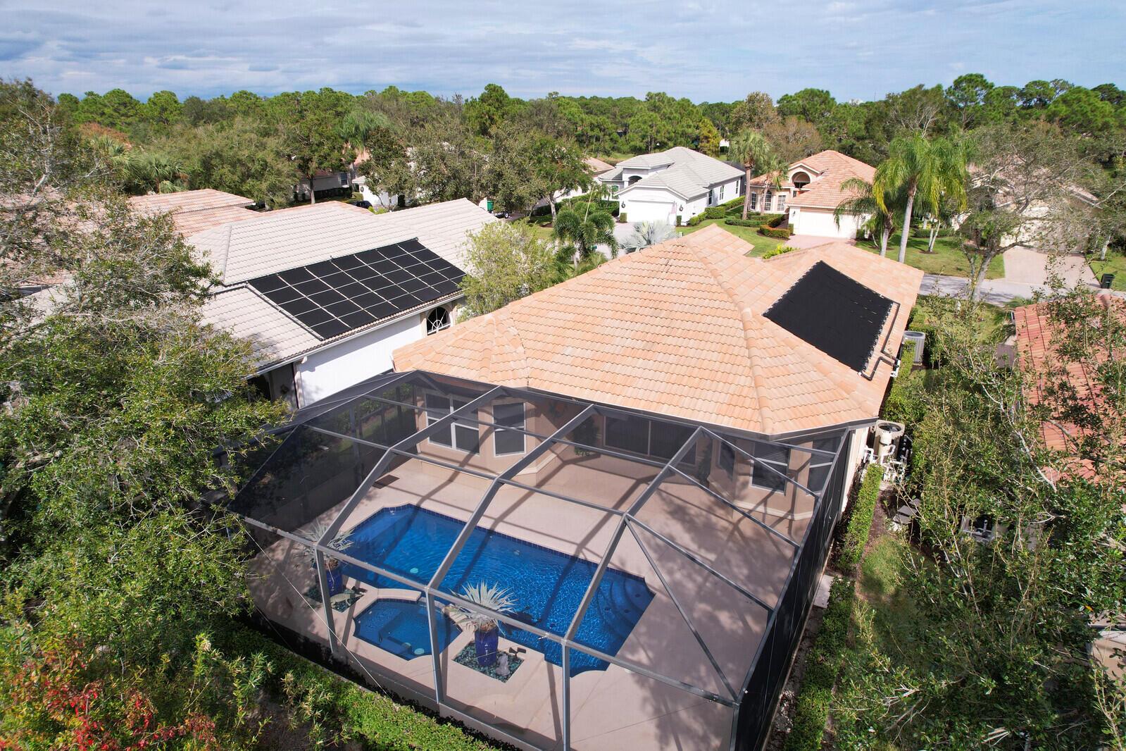 A TRUE GEM IN THE HEART OF PGA VILLAGE! Featuring a spectacular pool & spa complimented by an extended screened lanai-ideal for outdoor entertaining or peaceful relaxation. The pool is equipped with solar heating installed in 2018 & a new pool heater in 2023, providing year-round enjoyment in your own private oasis. This home boasts a light, bright open floor plan, freshly painted walls & brand new carpet in the bedrooms, providing a modern, welcoming feel throughout. Updates include a newer A/C & water heater, ensuring comfort & efficiency. Nestled close to the Legacy Golf & Tennis Club & The PGA Golf Club & it's 3 championship courses, a golfer's paradise. Don't miss out on this opportunity to own a move-in-ready home in one of the most desirable communities in the area, PGA Village!