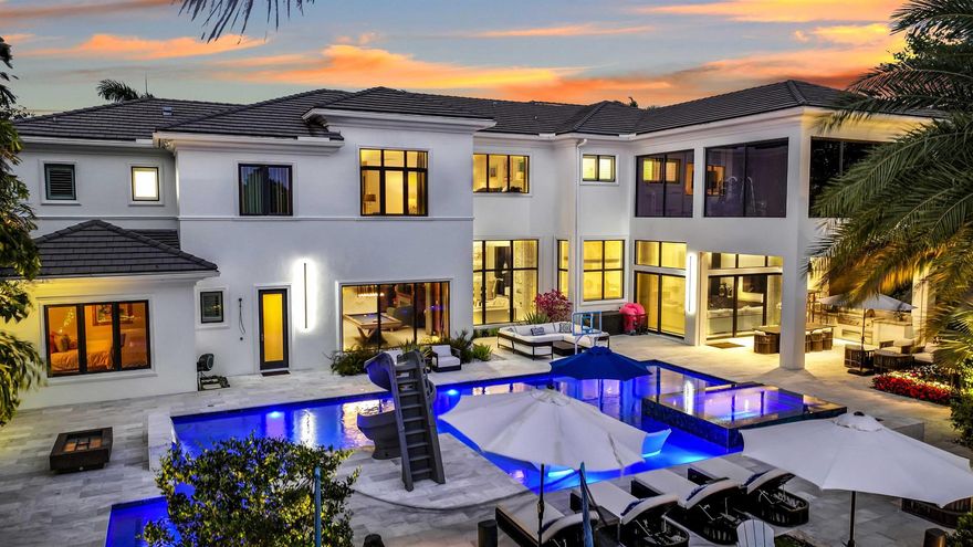 Rare opportunity to own a luxury custom estate with full golf equity membership available in prestigious Mizner Country Club. This exceptional property offers 6 bedrooms, plus two offices/club rooms and a home theatre. Marble floors, soaring ceilings, a chef's kitchen, elevator, and Lutron & Savant smart home systems. Enjoy a completely rebuilt custom theatre whole-house HEPA air filtration, and a 2nd floor gym overlooking the golf course from the primary suite for breathtaking views while you exercise.Designed for both relaxation and recreation, the estate features two elegant club rooms--one on each level--ideal for entertaining, lounging, or creating additional versatile living spaces.Outdoors, indulge in a resort-style backyard featuring a covered lanai with outdoor kitchen.