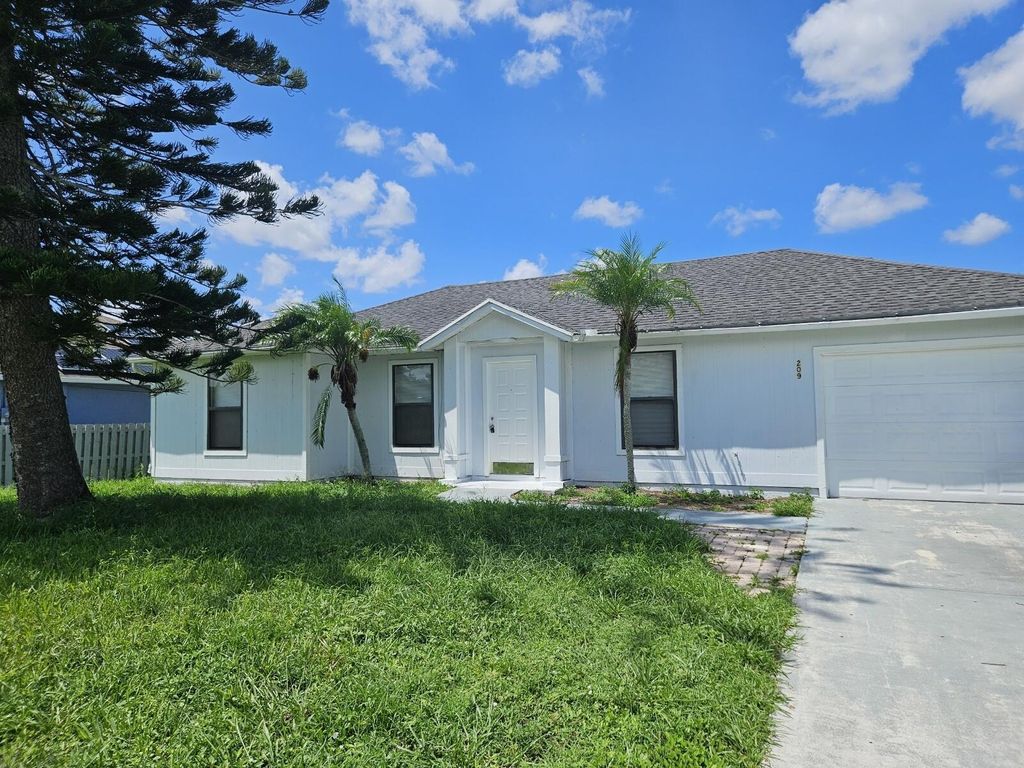 Photo of 209 SW Airview Avenue, Port Saint Lucie, FL 34984 (MLS # R11012662)