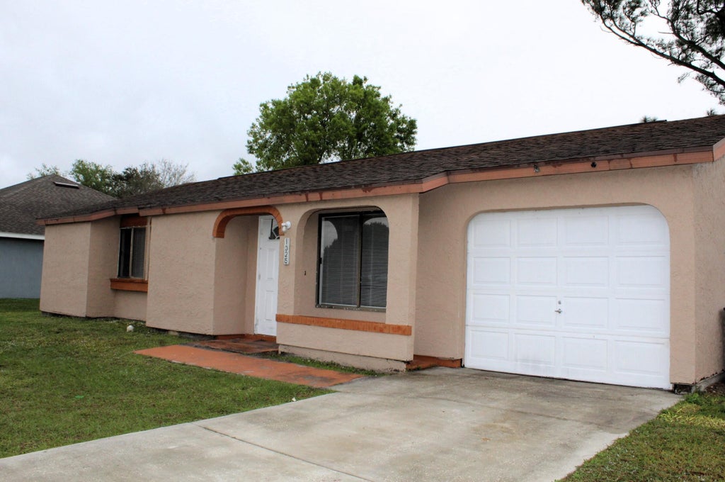 Photo of 1325 SE Sandia Drive, Port Saint Lucie, FL 34983 (MLS # R10961080)