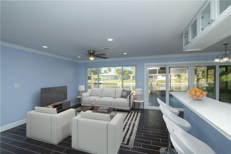 You will fall in love with this stunning waterfront home in Jenada Villas. This 3 bedroom / 2 baths home has been professionally renovated from top to bottom with no expense spared* Features include : Brand new impact windows & doors * Modern kitchen with quartz countertops, brand new appliances & plenty of storage * Screened porch overlooking the water* Tile floors throughout * Brand new bathrooms* Roof, A/C & water heater are just 1yr old* Upgraded electric * 70ft of water frontage w/ a new 20ft dock - ocean access w/ fixed bridges * Room for a pool * All new piping under the house ! * Separate storage /utility room next to the carport* Peaceful neighborhood w/ easy access to highways, restaurants & nightlife of Wilton Manors * Ready for new owners