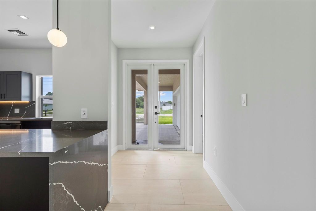 Photo of 4049 SW Port St Lucie Boulevard, Port Saint Lucie, FL 34953 (MLS # F10507686)