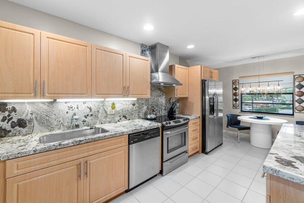 Photo of 68 EASTGATE Drive #D, Boynton Beach, FL 33436 (MLS # B26074117)