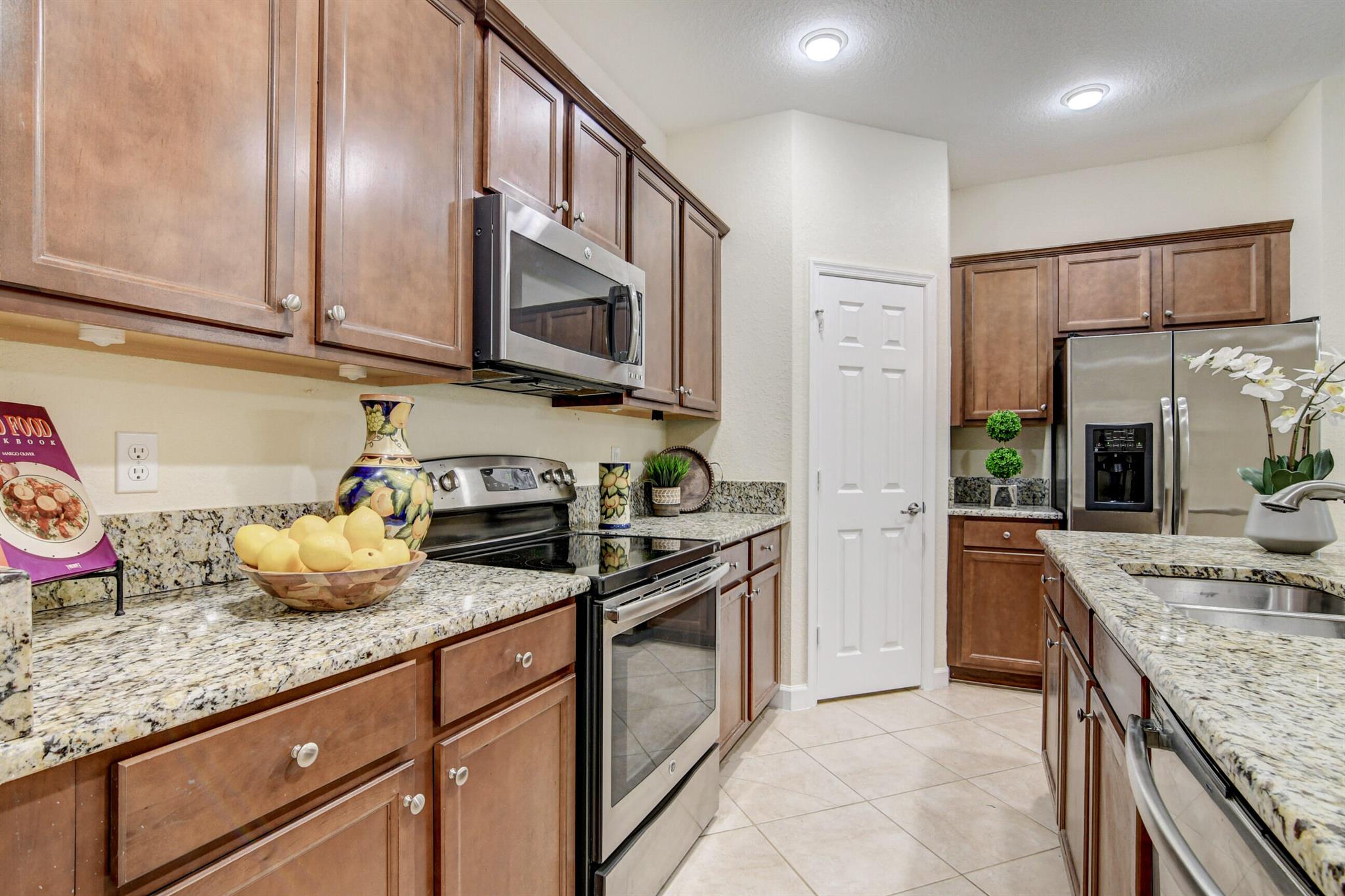 UPSCALE TOWNHOME IN BOUTIQUE COMMUNITY. GATED ENTRY AND CODED FRONT DOOR ENTRY. PRIVATE GARDEN VIEW FROM COVERED PAVER PATIO. STONEFRONT 2 STORY 3BEDROOM, 2.5 BATHS WITH 1 CAR GARAGE. GOURMET KITCHEN WITH GRANITE, STAINLESS, PANTRY. TILE ON THE DIAGONAL IN FOYER, POWDER ROOM, DINING AREA, FAMILY ROOM DOWNSTAIRS. LAMINATE ON STAIRS AND UPSTAIRS. DOUBLE DOOR PRIMARY BATH HAS TUB, DUAL VANITIES, AND SEPARATE SHOWER. PRIMARY BEDROOM GAS TRAY CEILING AND WALK-IN CLOSET. TWO ADDITIONAL BEDROOMS SHARE THE GUEST BATH AND UPSTAIRS LAUNDRY ROOM. COMMUNITY POOL AND TROPICAL FOLIAGE, A-RATED SCHOOLS, CLOSE TO MALL, SHOPS, RESTAURANTS, MEDICAL, EQUESTRIAN AND TURNPIKE.