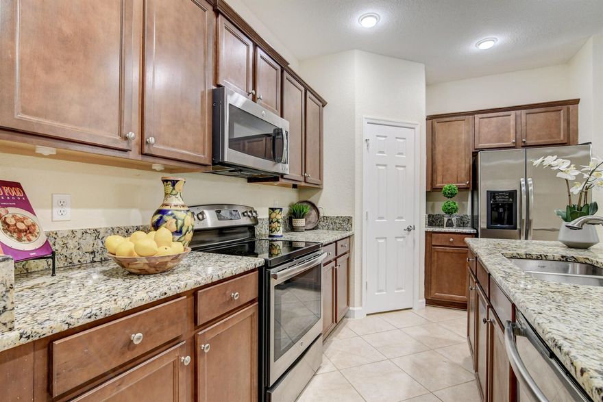 UPSCALE TOWNHOME IN BOUTIQUE COMMUNITY. GATED ENTRY AND CODED FRONT DOOR ENTRY. PRIVATE GARDEN VIEW FROM COVERED PAVER PATIO. STONEFRONT 2 STORY 3BEDROOM, 2.5 BATHS WITH 1 CAR GARAGE. GOURMET KITCHEN WITH GRANITE, STAINLESS, PANTRY. TILE ON THE DIAGONAL IN FOYER, POWDER ROOM, DINING AREA, FAMILY ROOM DOWNSTAIRS. LAMINATE ON STAIRS AND UPSTAIRS. DOUBLE DOOR PRIMARY BATH HAS TUB, DUAL VANITIES, AND SEPARATE SHOWER. PRIMARY BEDROOM GAS TRAY CEILING AND WALK-IN CLOSET. TWO ADDITIONAL BEDROOMS SHARE THE GUEST BATH AND UPSTAIRS LAUNDRY ROOM. COMMUNITY POOL AND TROPICAL FOLIAGE, A-RATED SCHOOLS, CLOSE TO MALL, SHOPS, RESTAURANTS, MEDICAL, EQUESTRIAN AND TURNPIKE.
