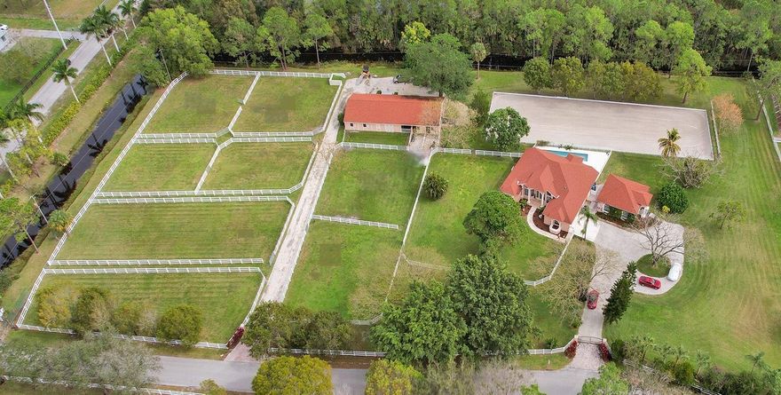 **REDUCED PRICE** Beautiful Equestrian Estate on 6 1/2 Acres of park like paradise. Would suit Dressage, Jumpers or any discipline. 11 miles to WEF.10 Stall Barn (Could be 14) with Tack Room, Feed Room Half Bath and Laundry plus 60 X 20 Meter Mirrored Dressage Arena (Could easily expand to a 100X 200 jumper arena) and 8 individual PaddocksBeautiful Main Residence offers 3 Bed 2 Bath Plus an office with soaring windows. Features include a stunning kitchen and a luxurious master suite and marble floors throughout. Triple Sliders open onto a huge patio with a lap pool, creating the perfect indoor-outdoor flow. A separate 2-Bedroom 2-Bath Guest House features Soaring Ceilings, a gorgeous Kitchen and newly remodeled bathrooms.