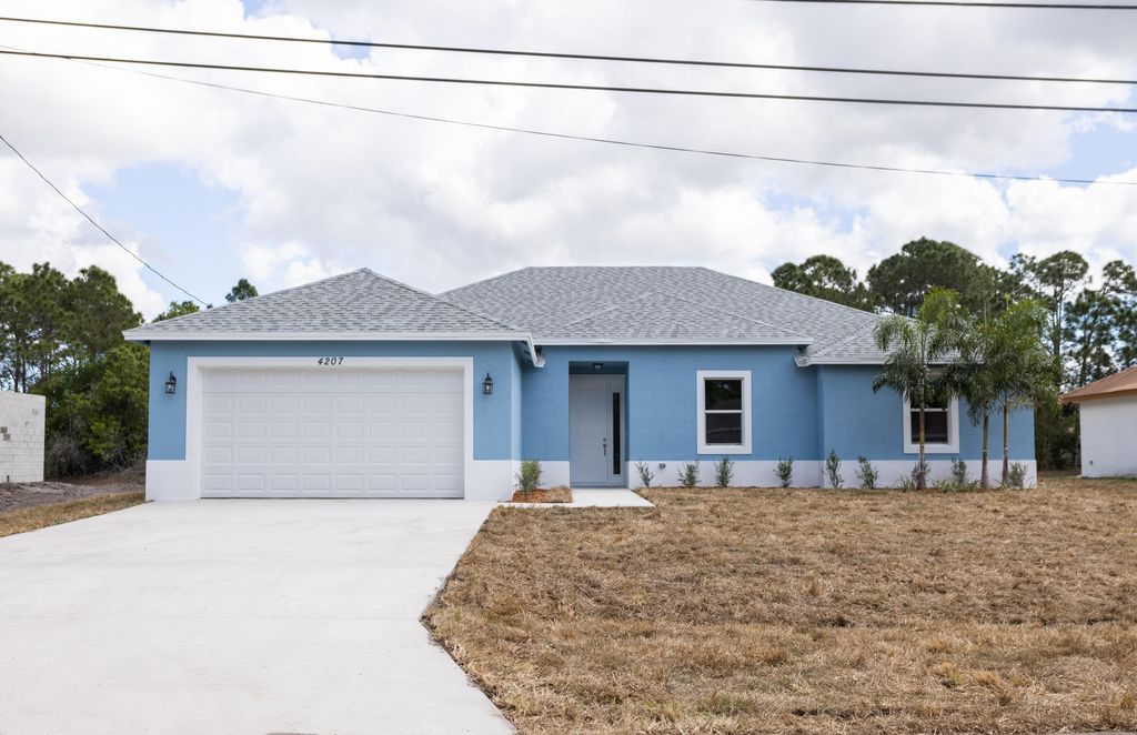 Photo of 1172 SW Lawndale Avenue, Port Saint Lucie, FL 34953 (MLS # R10792221)