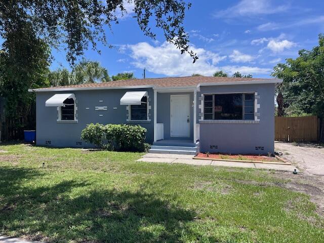 Experience coastal living at its finest in this fully renovated, turn-key 4-bedroom, 2-bath single-family rental in Riviera Beach. Gleaming marble-look floors flow throughout a light-filled interior freshly painted in serene hues, while the brand-new kitchen features crisp white cabinetry, stainless-steel appliances, and an elegant waterfall sink. A versatile private suite complete with its own exterior side-door entrance and convenient back-kitchen access offers the ideal in-law quarters, home office, or guest retreat. Outside, an oversized, secure fenced backyard provides ample room for al fresco dining, playtime, or container gardening amid lush tropical landscaping (see supplement)...