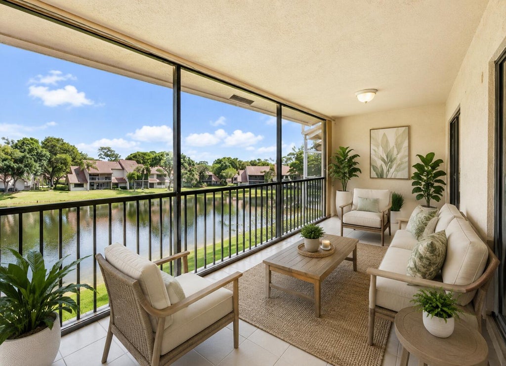 Photo of 5751 Coach House Circle #E, Boca Raton, FL 33486 (MLS # B26057857)