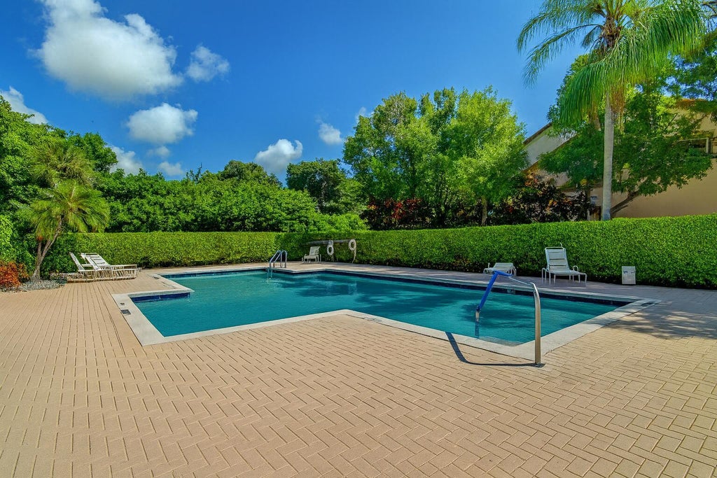 Photo of 5751 Coach House Circle #E, Boca Raton, FL 33486 (MLS # B26057857)