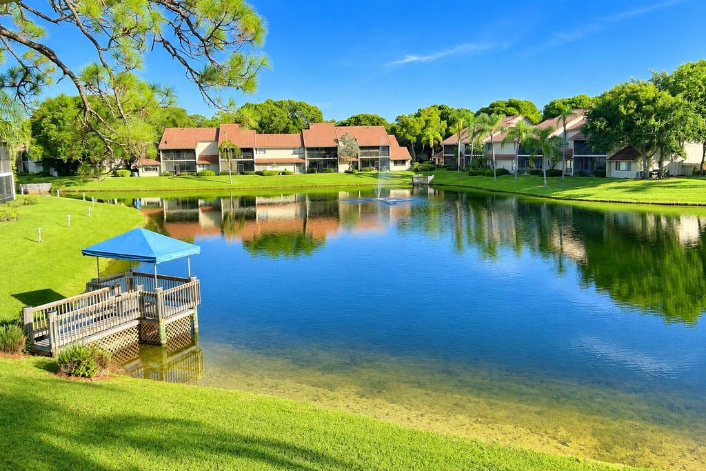 Photo of 5751 Coach House Circle #E, Boca Raton, FL 33486 (MLS # B26057857)