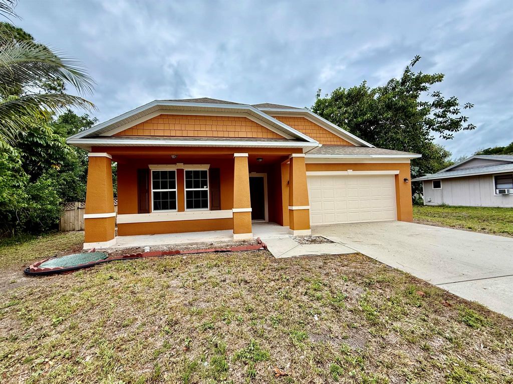 Photo of 514 NW Riverside Drive, Port Saint Lucie, FL 34983 (MLS # R11089877)