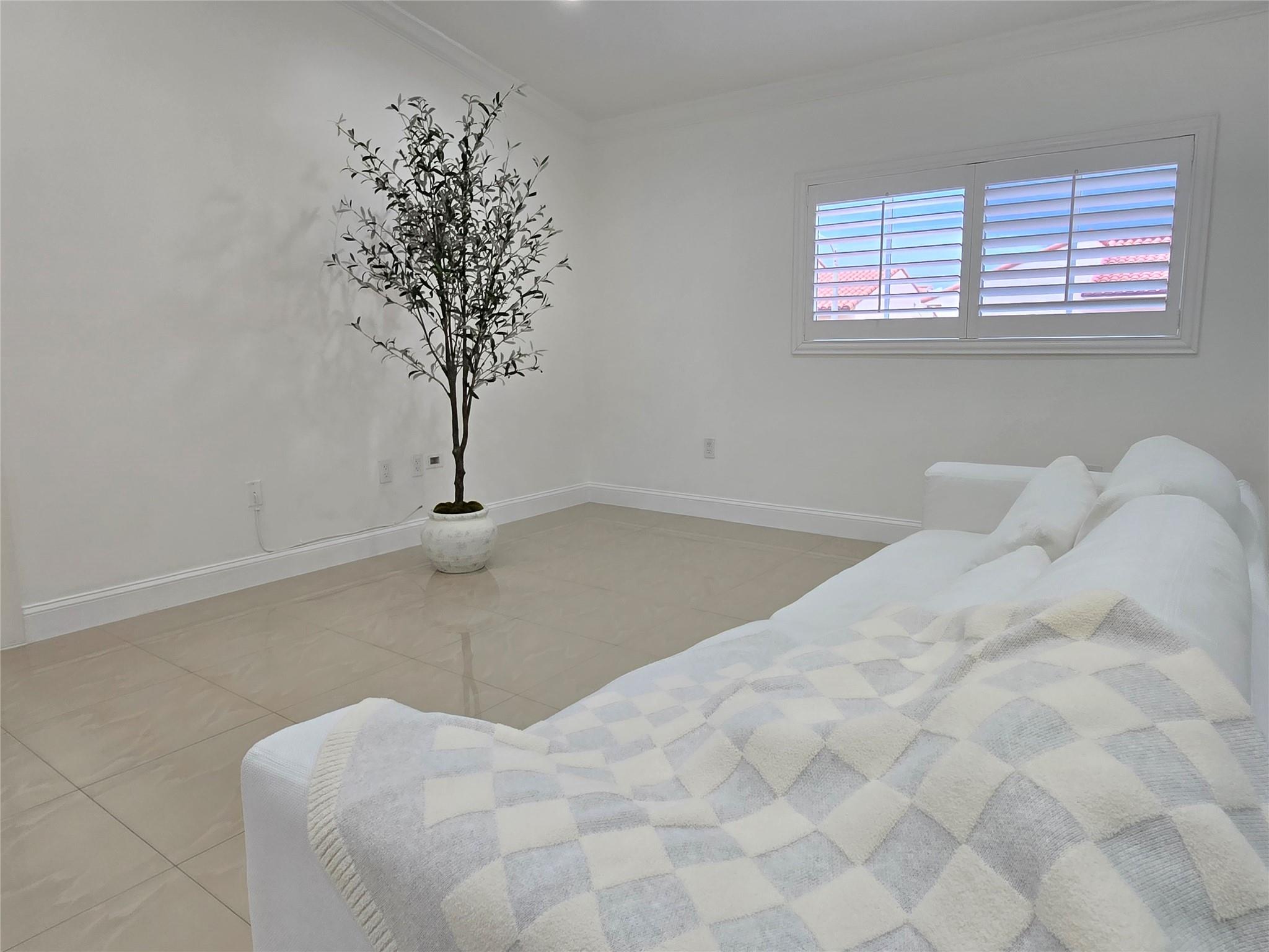 This move-in ready condo in Hialeah offers a modern and convenient lifestyle with impact windows, plantation shutters, LED lighting, and freshly painted white walls that enhance its brightness. It features an in-unit LG and Samsung washer and dryer, built-in cabinets for added storage, a digital thermostat, and a tankless water heater for efficiency. The kitchen is equipped with stainless steel appliances and quartz countertops, making it a stylish and functional space ideal for comfortable living.