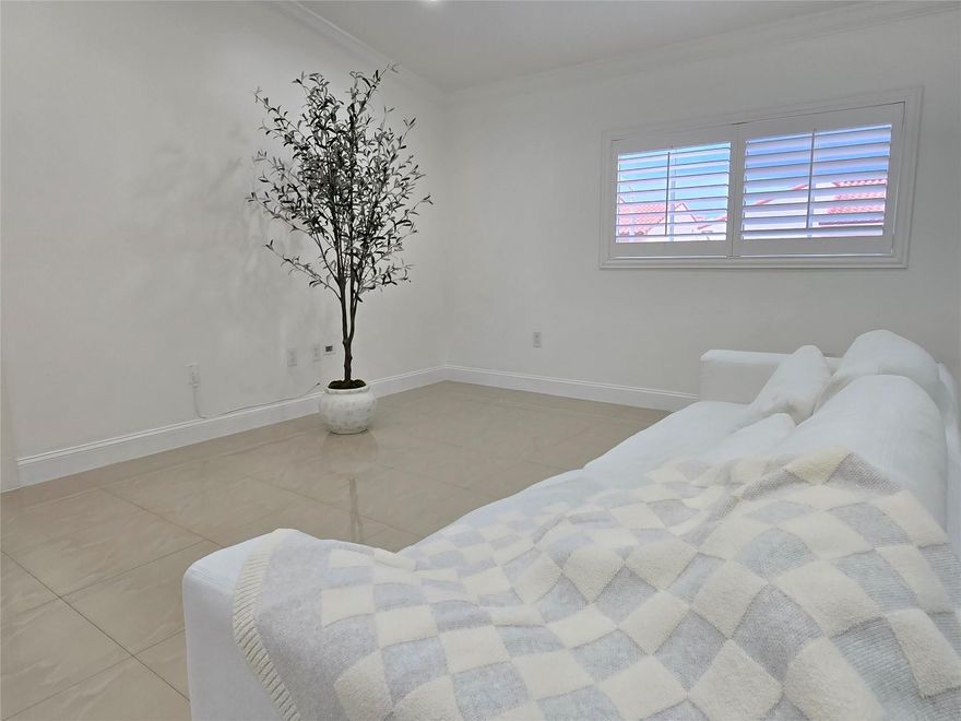 This move-in ready condo in Hialeah offers a modern and convenient lifestyle with impact windows, plantation shutters, LED lighting, and freshly painted white walls that enhance its brightness. It features an in-unit LG and Samsung washer and dryer, built-in cabinets for added storage, a digital thermostat, and a tankless water heater for efficiency. The kitchen is equipped with stainless steel appliances and quartz countertops, making it a stylish and functional space ideal for comfortable living.