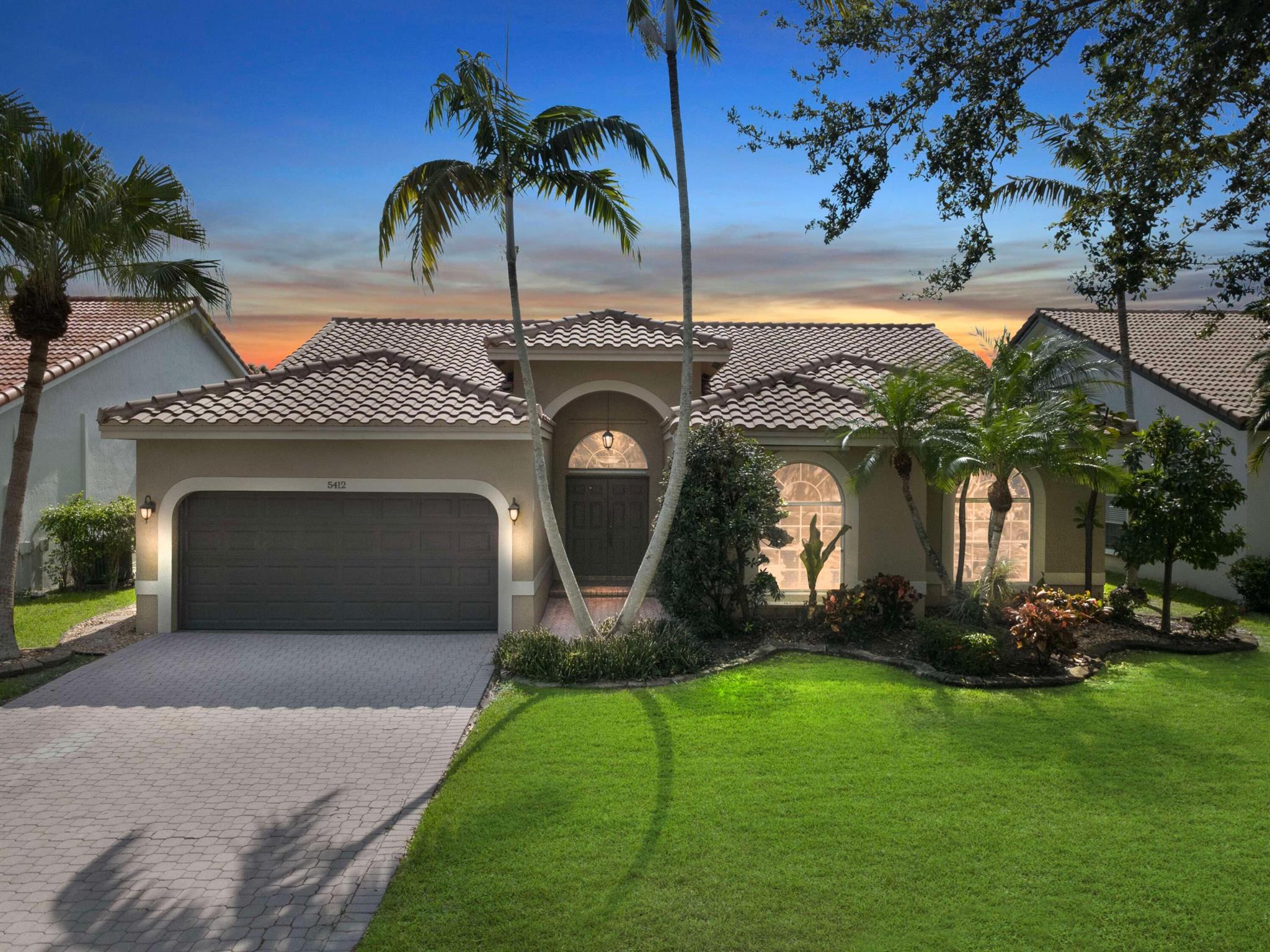 This elegant 4 bedroom, 2.5 bath home redefines upscale living with a perfect blend of comfort and class. Step inside to soaring ceilings, expansive living spaces and an abundance of natural light. The open concept layout designed for both upscale entertaining and everyday comfort offers a gourmet kitchen complete with granite countertops, stainless steel appliances, ample cabinetry, breakfast island and built in wine cooler. The oversized primary suite is a private retreat featuring water views, double closets, and spa-inspired en-suite bath with dual vanities, soaking tub and separate walk-in shower. Enjoy seamless indoor-outdoor living on screened patio overlooking the water -perfect for sunsets and weekend gatherings. Welcome Home to Luxury where Sophistication Meets Serenity.