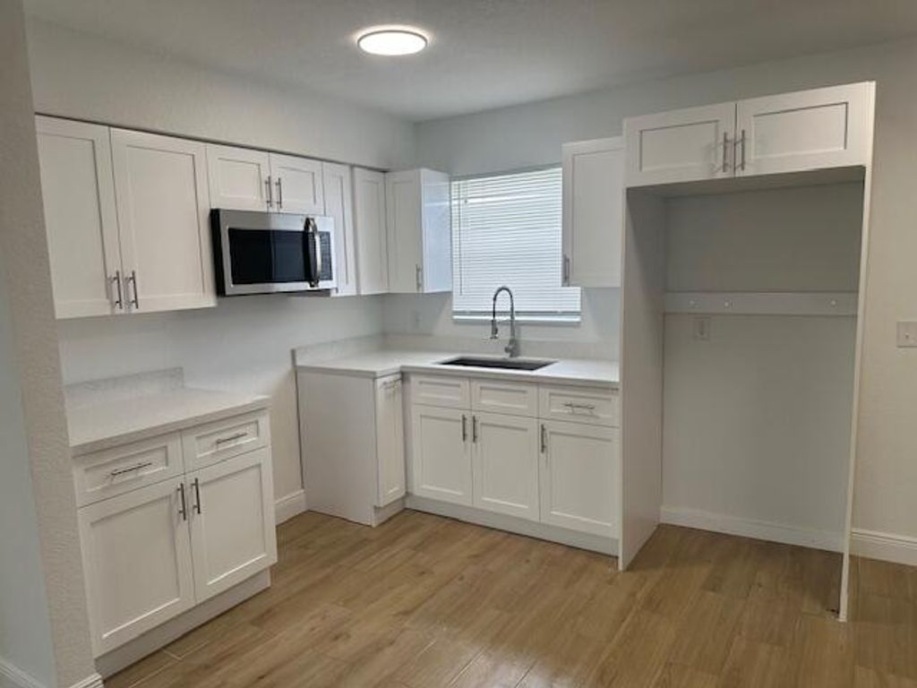 Photo of 491 W Jordan Boulevard, Pahokee, FL 33476 (MLS # R11159435)