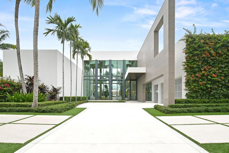 In a league of its own, this architectural masterpiece in Jupiter's prestigious Admirals Cove features a sleek modern design, soaring ceilings, and 100 ft of waterfront with no fixed bridges for quick Atlantic access, making it a boater's dream. Highlights include 5 bedrooms, a luxurious first-floor master suite, VIP guest room, a chef's dream kitchen with Italian Valcucine cabinetry, backlit onyx countertops, and Wolf appliances, exquisite wood and stone finishes, a temperature-controlled wine wall, Crestron automation, and elevator. Step out back and be dazzled by the resort-style backyard, complete with a pool, spa, sundeck, summer kitchen, cabana bath, loggia with retractable screens, a private dock, lift and partial Intracoastal views. Offered furnished--when only excellence will do