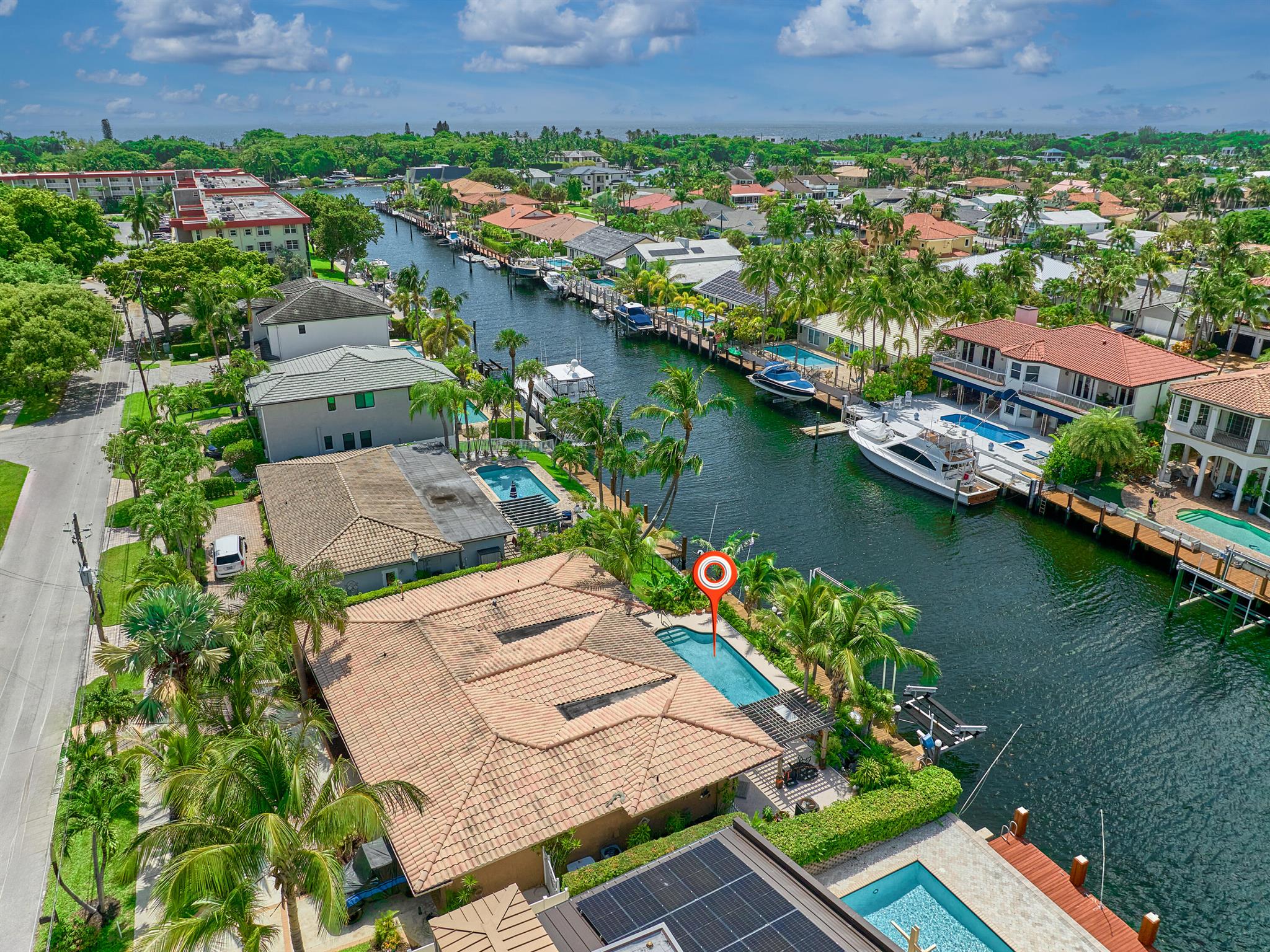 Prime Investment Opportunity - Coral Key Villas, Lighthouse Point. Attention investors and builders--this is the one you've been waiting for. Situated on an 8,000 sq ft lot with Southeast exposure and 80 feet of water frontage on one of Lighthouse Point's widest canals (only the Grand Canal is wider), this property offers incredible potential for redevelopment.With no fixed bridges and direct access to both Hillsboro and Boca Inlets, the location is a boater's dream--and ripe for a luxury spec build or total transformation. The existing 4-bedroom, 3-bath pool home is ready for a full renovation or teardown to make way for a custom estate.