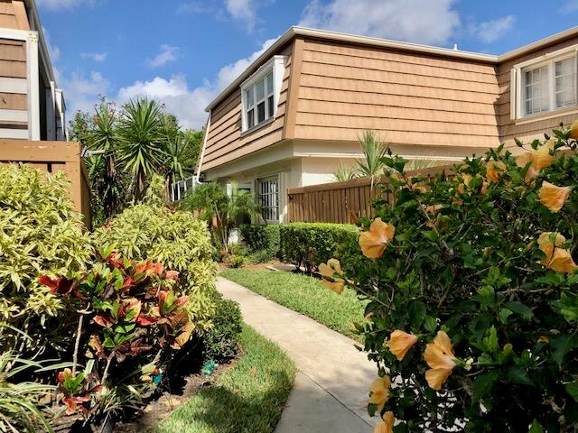 A Great 2-level corner unit townhouse, with 3 bedrooms, 2.5 bathrooms, spacious living room, separate dining room, large screened-in patio. Hurricane-impact windows on upper level and accordion shutters on main level. Laminate and tile flooring throughout the main floor. Newer appliances, including full-sized washer and dryer. Abundant storage space throughout the home. Two assigned parking spaces (119 & 120). Great location in Palm Beach Gardens in the Winchester Court subdivision, one of the most desirable areas in the region.