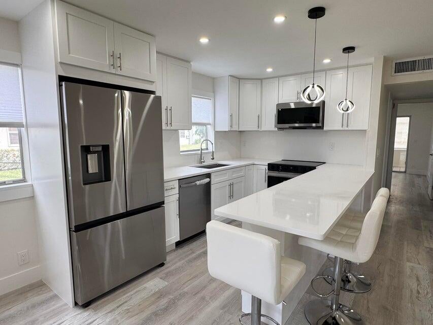 Photo of 108 BRITTANY Terrace #C, Delray Beach, FL 33446 (MLS # B26062268)