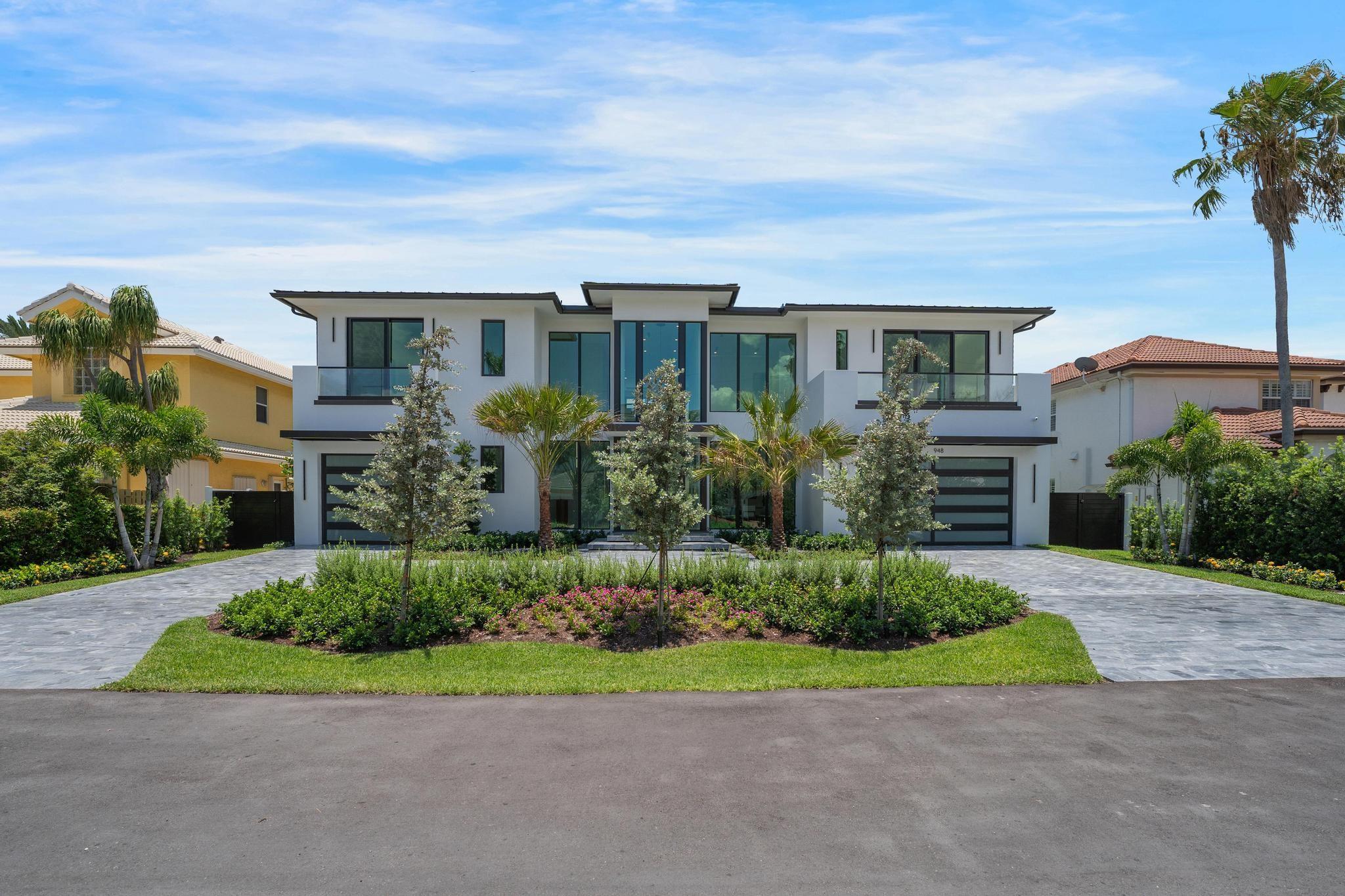New Construction - 90' of Water frontage - NO Fixed Bridges - Ocean Access - Approx. 5 minutes From Atlantic Ave. This beautiful 7,679 sq. ft entertains 6 en-suite bedrooms, 7.5 baths, 2 primaries. Smart home features Wolf/Sub-Zero appliances, Taj-Mahal with lather finish counter top, Cristallo lit wine room and bar, smart lighting, elevator, wet bar, and marble staircase. Outdoors boasts a saltwater pool, spa, summer kitchen, 47KW generator, Wi-Fi sprinklers, a new seawall and dock with plumbing and electric, power ready for 2 boat lifts. Metal roof, impact windows, and built-in closets throughout. All pre-wired for sound system, shades, sound and video. Move-in ready with top-tier luxury!