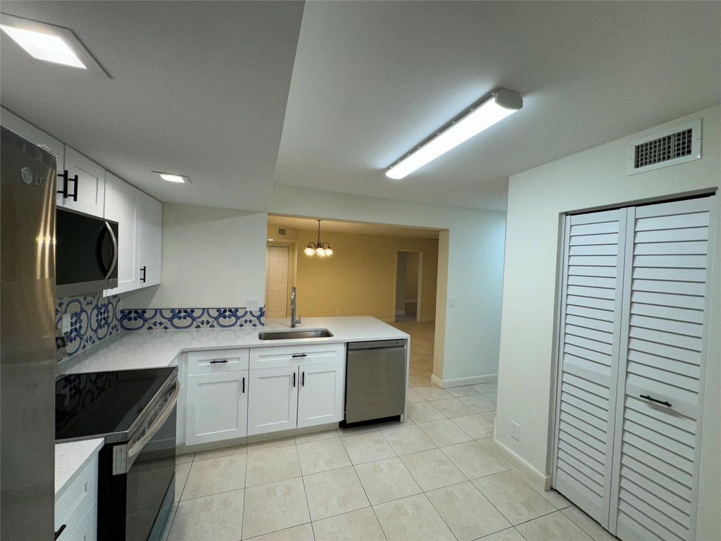 Photo of 5741 Riverside Drive #102, Coral Springs, FL 33067 (MLS # F10401805)