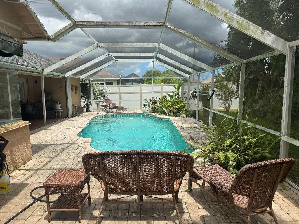 Photo of 2449 SW Aberdeen Street, Port Saint Lucie, FL 34953 (MLS # R11114922)