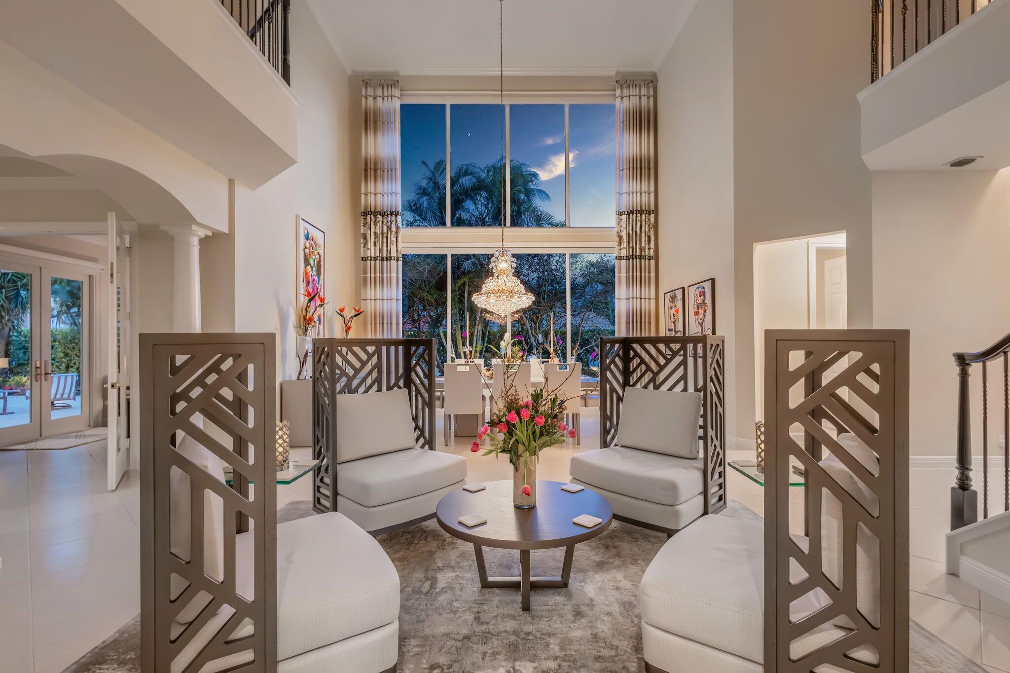 **PRICE REDUCTION!!** Location, Lot Size, Stunning Water views. Plus access to day docks. Now is the time to make your move! This five-bedroom home is one of one, sitting on an oversized corner lot in the exclusive gated community of Prosperity Harbor. This home sits on the largest lot in the entire development directly next to the clubhouse, pool, and day docks. Ideal setup for indoor/outdoor entertainment and privacy. Amenities include a grand two-story living and dining area featuring dramatic picture windows overlooking a custom designed garden with beautiful exterior lighting. Gourmet Chef's eat-in kitchen. First floor VIP guest bedroom. Spacious master suite with Stunning water views. Home office overlooking saltwater pool, lanai, and putting green.