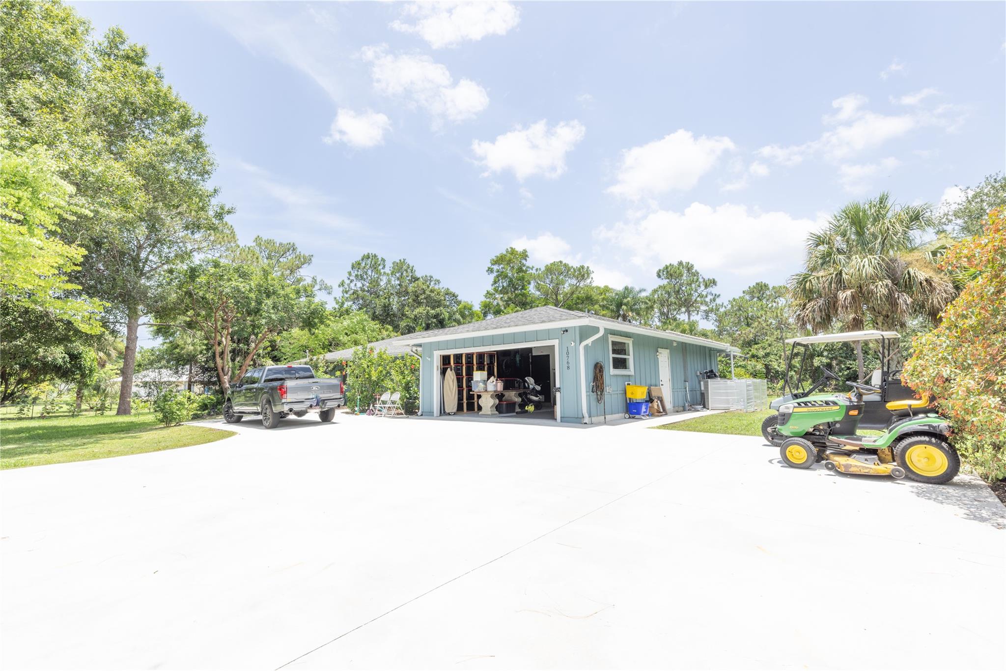 Welcome to your new home in Jupiter Farms. Surrounded by lush tropical plants, fruit trees & plenty of lawn space. Relax on the spacious pool area patio, or on your private wellness deck! This home boasts upgrades such as newer AC, fully fenced yard w/electric gate, irrigation system, well water pump, septic tank, solar heated pool, Fire Pit&raised garden beds that are ready for planting a shed for all your tools/equipment. There's even a chicken coop! Inside is reverse osmosis water system, gorgeous flooring, laundry room, finished master bedroom closet & back of house boasting family room, kitchen, dining area with sliding glass doors, and pass-thru to the back patio/pool area...perfect for Florida living/entertaining. Near Publix&Beaches in A-rated schools. Great for families w/kids.