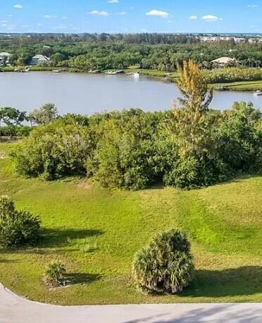 Survey available upon request. Prime waterfront lot on a barrier island in a gated community. Low HOA fee. Convenient to the ocean, mainland, 50-miles to Cape Canaveral on A1A. Choose your own builder and build your dream home. 110-inear feet of waterfrontage. Waterfrontage on lagoon in the ICW, with access to the Indian River (Intracoastal) and ocean. In close proximity to the Environmental Learning Center. To the south & east of Subject is 118.95 acres, owned by the Indian River Land Trust, Inc.