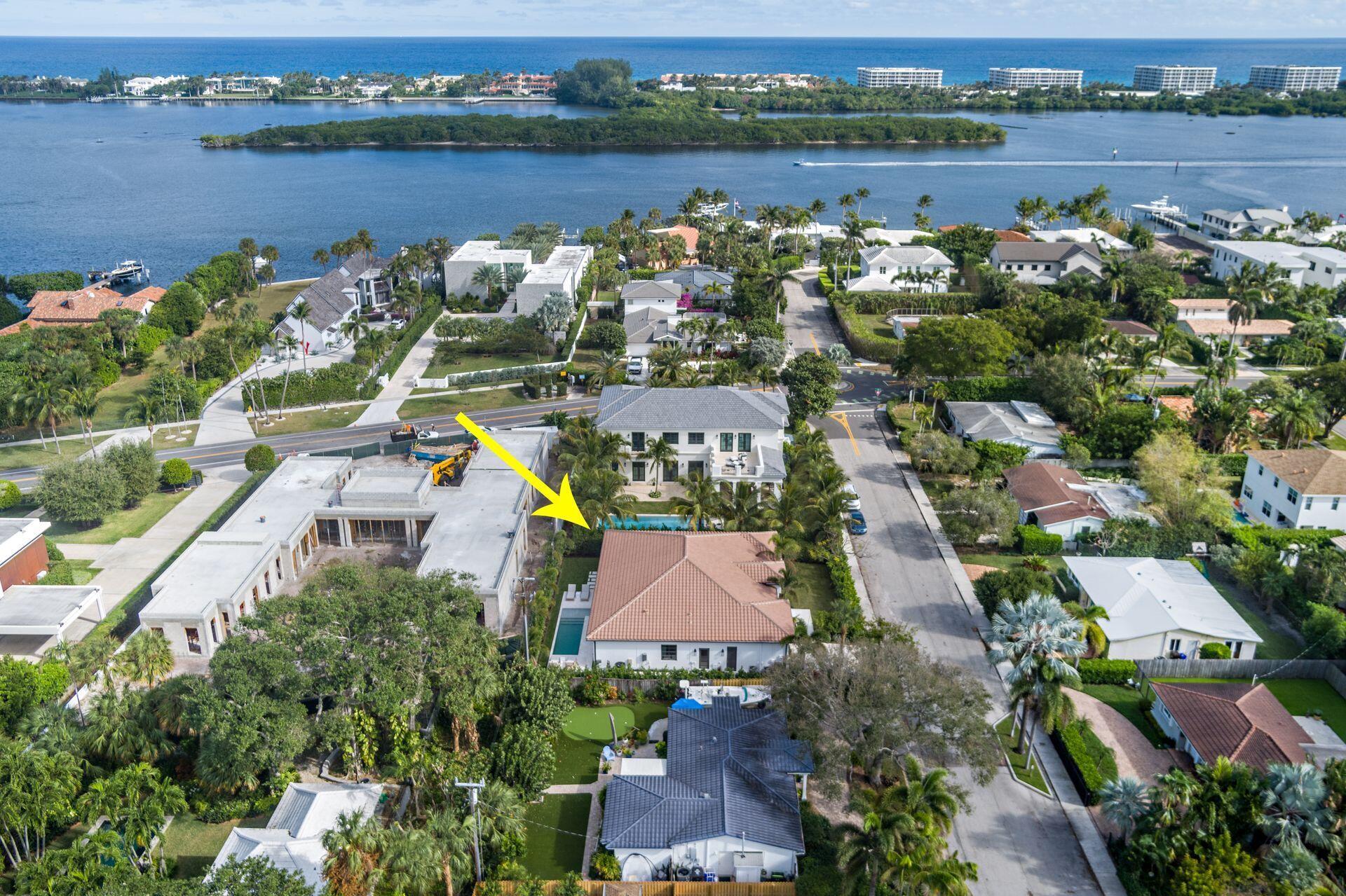 Located one home off South Flagler Drive, stunning & serene one story, 4BR/4.5BTH Bermuda style, approx. 3500 sq. ft. with 2 car garage. Seamless indoor-outdoor flow, with abundant natural light enhancing the elegant design & neutral color palette. 10 foot ceilings, recently renovated elements including quartz clad fireplace & wide plank floors throughout adding to the home's refined aesthetic. Gorgeous kitchen with quartz counters, waterfall island & modern stainless steel appliances including gas range & wine fridge. Custom cabinetry flows effortlessly into the informal living/dining spaces. All bedroom features ensuite baths with a dual vanity & soaking tub in the primary. Lush landscaping & vibrant foliage create an inviting oasis complimented by the poolside lanai. Impact windows.
